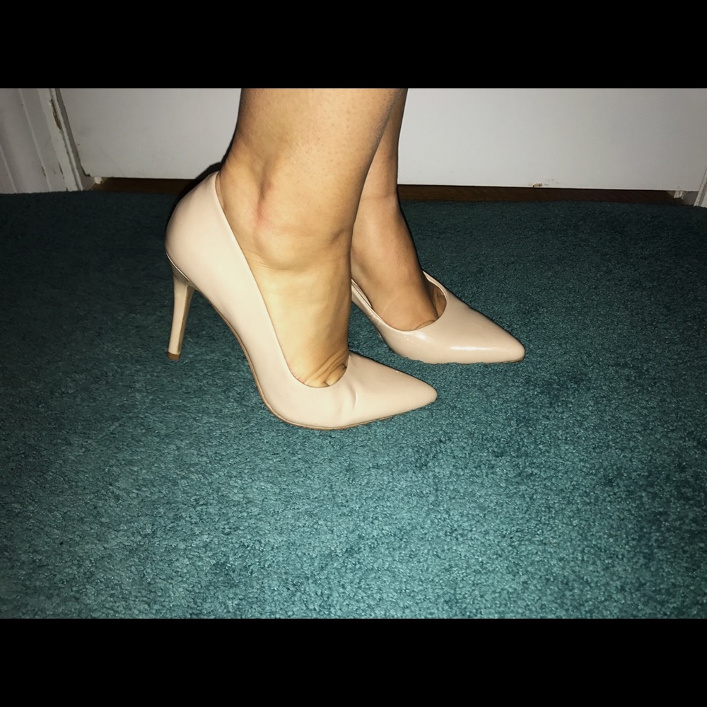 Nine West pointy toe heels in nude.